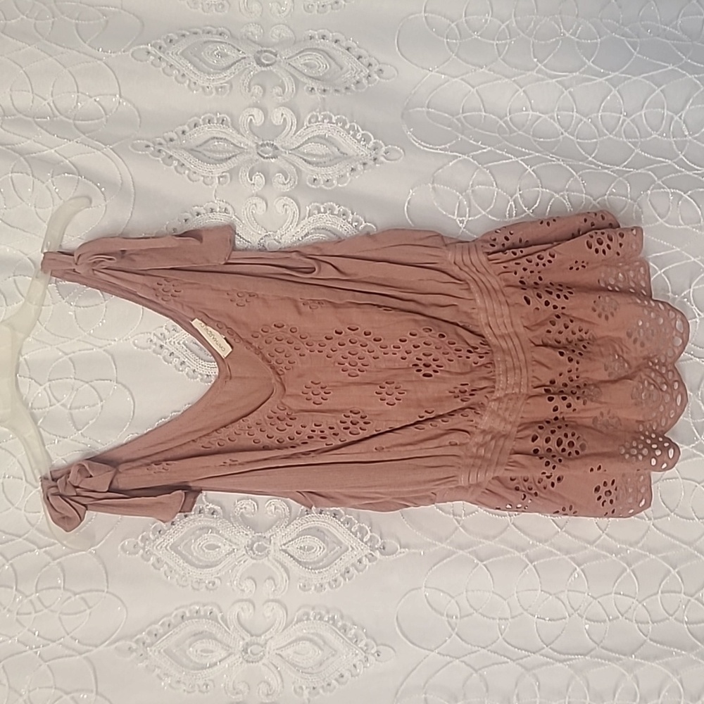 Sleeveless, pink Cynthia Rowley eyelet blouse.